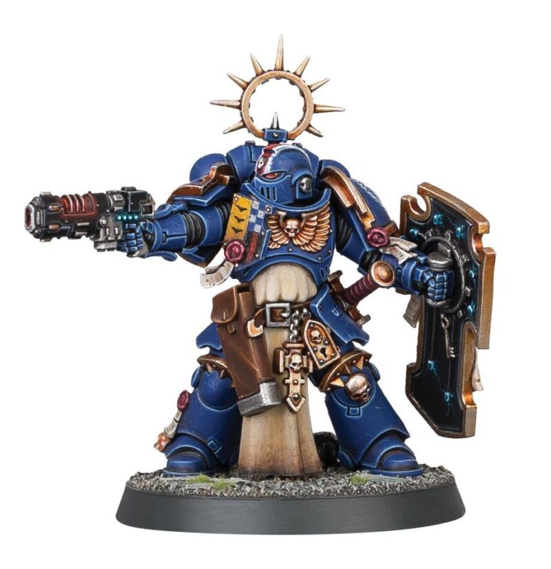 Powerful Space Marine figurine with a shield and pistol, ready for battle in Warhammer 40,000.