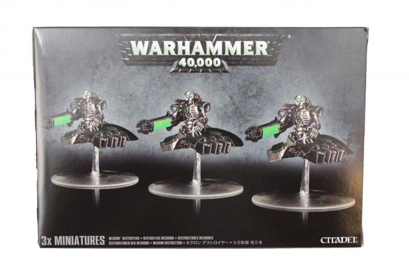 Intricately detailed Warhammer 40,000 miniatures in dynamic poses on clear bases, showcased in a sleek box.