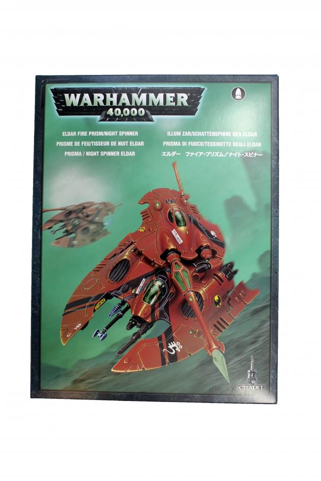 Warhammer 40,000 Futuristic Spaceship Model with striking red design and deep green background.