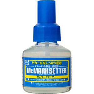 Mr. Mark Setter: Precise decal adhesion solution for model enthusiasts with clear liquid and blue cap.