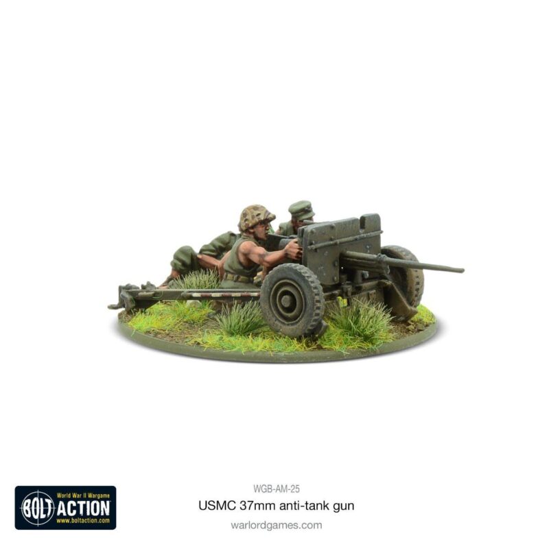 Miniature USMC 37mm anti-tank gun model with soldiers in World War II-era uniforms.